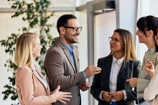 Business Professionals Engaging in a Productive Discussion in a Modern Office Setting
