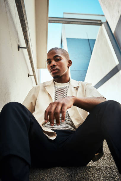 istock Stylish Young Man Sitting on Urban Staircase on a Sunny Day 2199341729