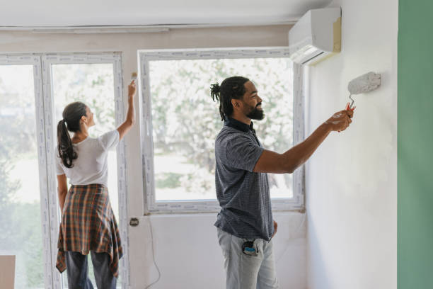 istock Couple Engaged in Painting DIY Project Indoors 2199344046