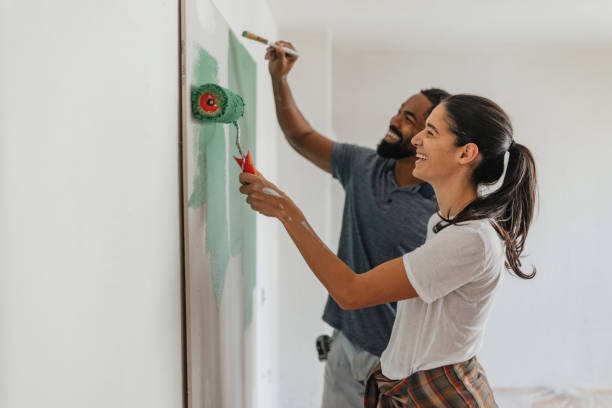 istock Painting a Wall Together: Love and Collaboration 2199344371