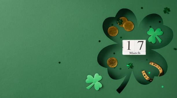 istock St. Patrick's Day themed image with green clovers, golden coins, and festive decor 2199347777
