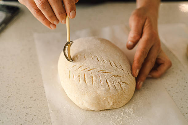 istock Woman preparing sourdough bread at home 2199348018