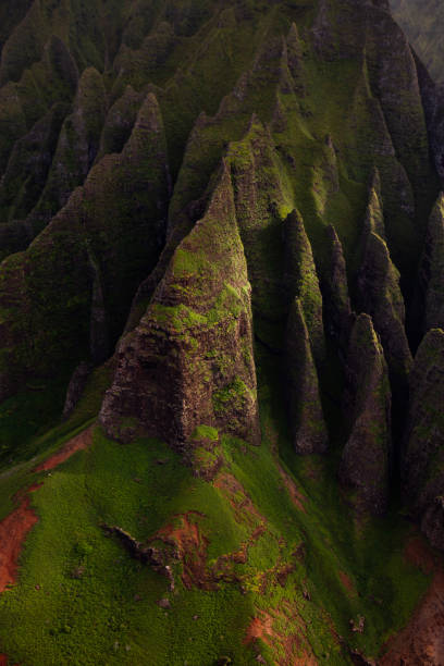 istock Napali Coast Massive Rippled Mountains in Intense Shadows from Helicopter View in Kauai Hawaii 2199350523