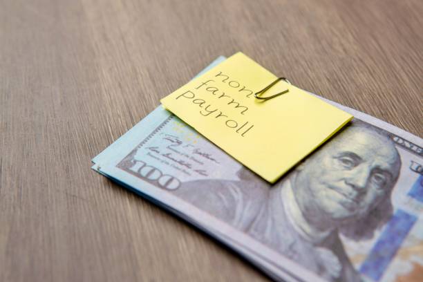 istock A yellow sticky note with the words Non-Farm Payroll written on it. 2199350816