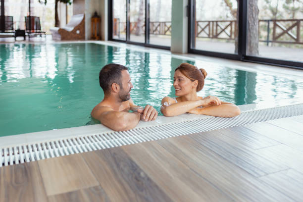 istock Romantic Getaway: Couple Enjoying a Relaxing Pool Day 2199350972