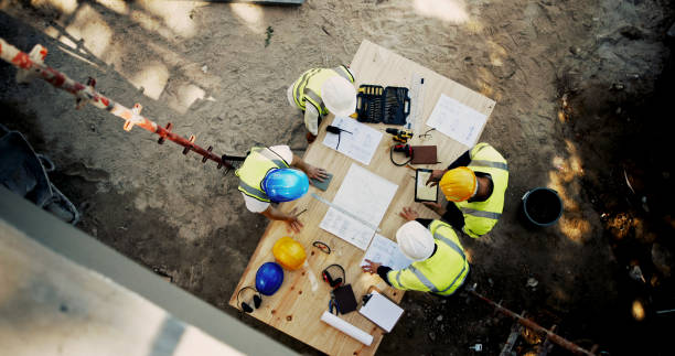 istock Architecture, tablet and business people with blueprint for construction site, building and planning. Above, engineer team and employees with ideas for industry renovation, infrastructure and meeting 2199351032