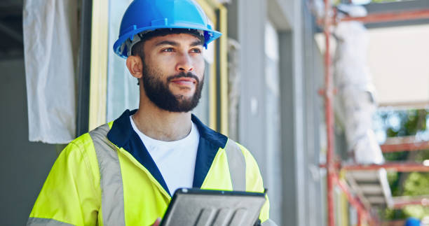 istock Man, tablet and thinking at construction site, architecture and checklist with inspection for property expansion. Person, perspective and civil engineering with review for real estate in Colombia 2199351056