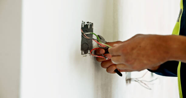 istock Man, hands and wires on construction site for renovation, connection or electrician with tools. Electrical engineer, switch fitting or cables in building wall for current flow, inspection or handyman 2199351094