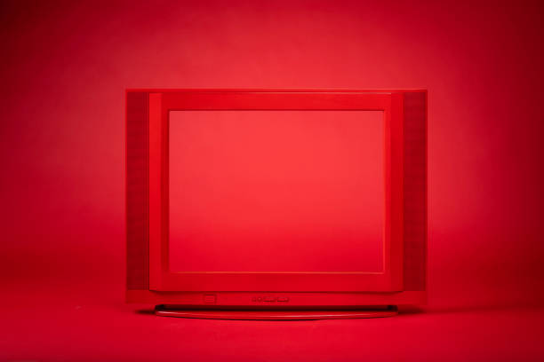 Modern horizontal digital screen, resembling a monitor or large tablet with sleek thin black bezel. Entire display area is filled with soli vibrant bright red color and copy space