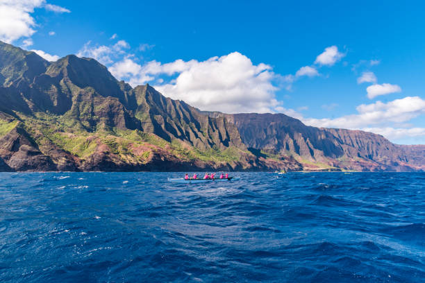 istock Rugged Napali Coast cliffs in Kauai with canoes on sunny day 2199353188