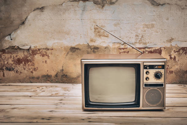 istock Retro old television with blank screen on old wall background 2199353282