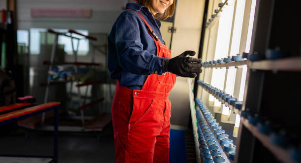 istock Young female artist working in a warehouse 2199354534
