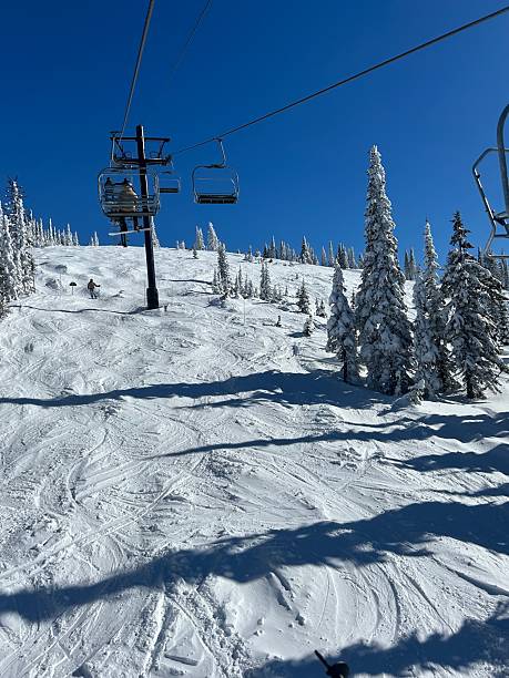 istock Ski Lift Over Snowy Mountain on a Clear Day 2199354774