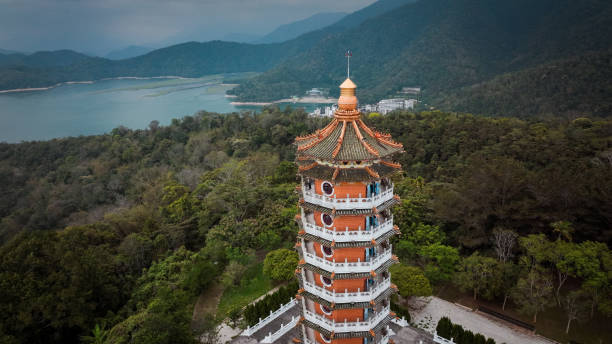 istock Exploring a traditional pagoda in Taiwan surrounded by lush mountains and serene water 2199355288