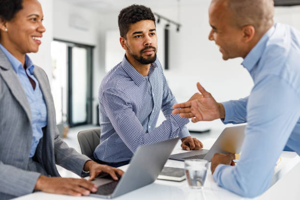 istock African American business team having a discussion in the office. 2199355331