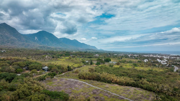 istock Panoramic view of lush landscape and mountains in Taiwan during a cloudy day 2199355421