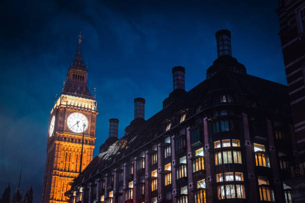London, UK - February 19, 2024: A low angle view of Big Ben at dusk in London, England.
