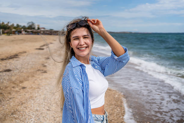 istock Happy woman on the beach 2199358345