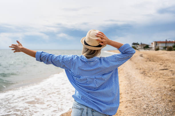istock Woman enjoying her summer vacation 2199358586