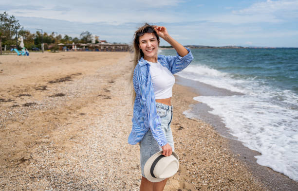 istock Happy woman on the beach 2199358772