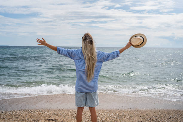 istock Woman enjoying her summer vacation 2199358797