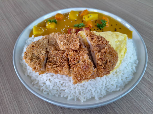 istock Serving Plate Of Chicken Curry Rice With Chicken Meat, Steamed Rice, Fried Omelette Eggs, Carrot Diced, Diced Cube Potatoes, Cherry Tomato Slices, Parsley, Sesame Seed And Savory Curry Sauce. Food Menu. 2199360130