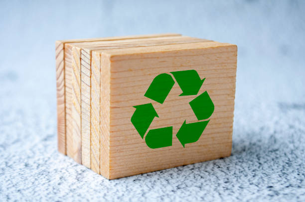 istock Isolated recycle symbol on wooden square 2199360934