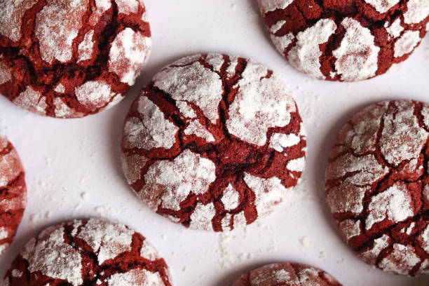 istock Red velvet crinkle cookies on a white baking paper. 2199362327