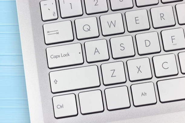Caps Lock key on laptop close up. International Caps Lock Day