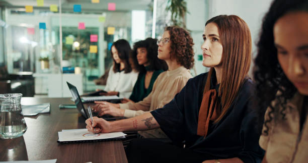 istock Meeting, workshop and conference with business people in office for seminar, teamwork and acquisition opportunity. Planning, asset valuation and training with group of women in boardroom for client 2199364729