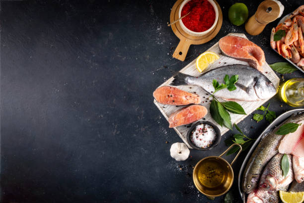 istock Variety fish and seafood background 2199365208
