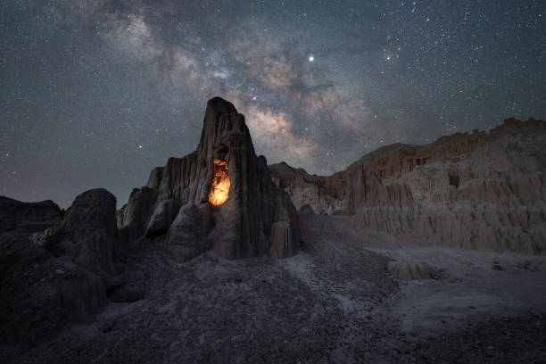 istock Milky Way Galaxy over an illuminated rock cave in Cathedral Gorge State Park Nevada 2199366985