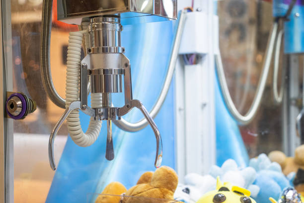 istock close up of metal claw machine 2199367743