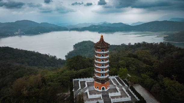 istock Towering pagoda overlooking Sun Moon Lake and mountains in Taiwan under a dramatic sky 2199369919