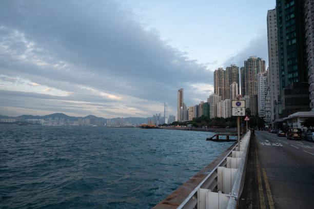 Hong Kong, China - December 6, 2023: view of Belcher Bay as seen from Kennedy Town in Hong Kong, showcasing the scenic waterfront and urban surroundings.