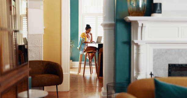istock Doorway, laptop and remote work with woman in home office for online design or web development. Computer, planning and social media with freelance employee in apartment for creative career or job 2199374564