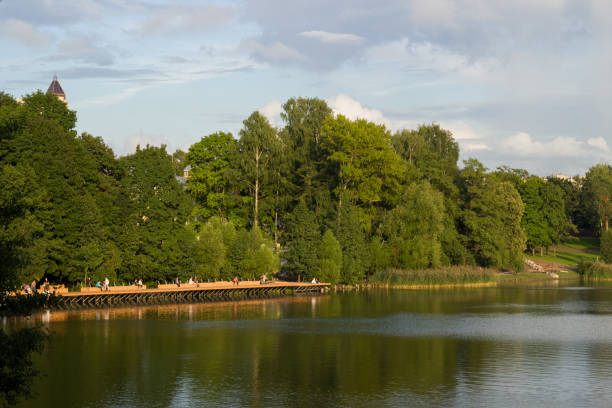 istock People are relaxing on the lake shore 2199375168