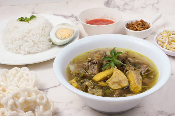istock Indonesian Soto Sapi: A Delicious Beef Soup with Rice, Egg, and Crackers 2199377998