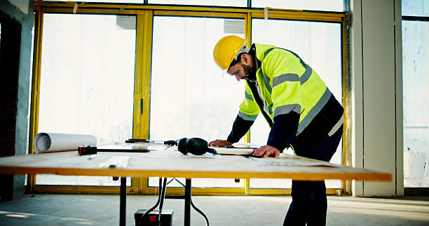 istock Architecture, inspection and blueprint with man on construction site for building, real estate and planning. Engineer, industrial and property developer with person for contractor and renovation 2199378705