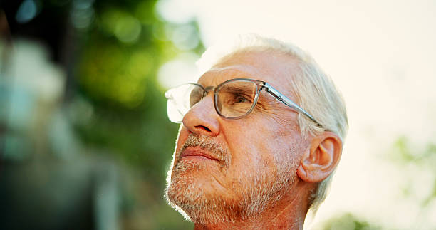 istock Ideas, outdoor and mature man with glasses for thinking, memory or reflection in nature. Spectacles, question and face of senior male person in park with wonder, decision or mindfulness in morning. 2199378738