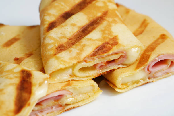 istock Grilled crepes with ham and cheese 2199379410