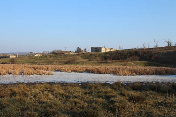 istock A field with a building in the background 2199381291