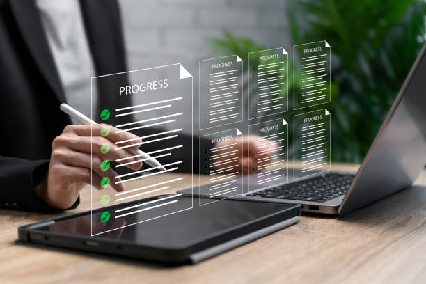 istock Work report, Document progress check, Report online concept, Businesswoman check and approved work report, Schedule, Checklist,  Document verification, verification, Digital Checklist, Task Management 2199383007