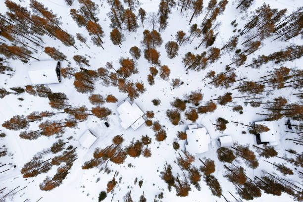 istock Snowy mountain huts in autumn, drone view 2199384010