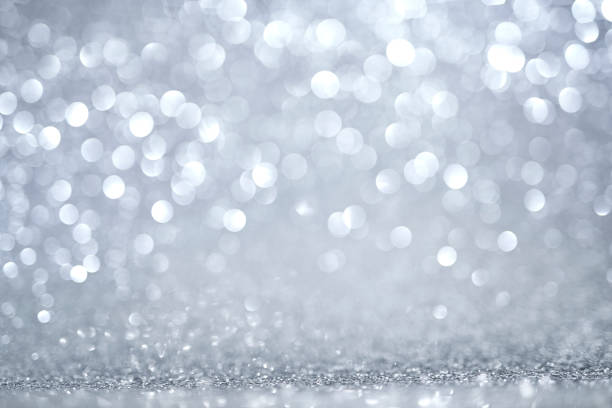 istock Silver bokeh lights on the Merry Christmas background. 2199384034