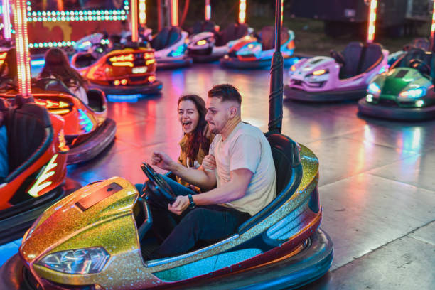 istock Joyful Girlfriend Laughing After Escaping Bumper Car Hit at the Last Moment 2199385253