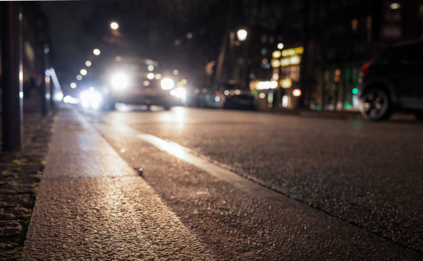 istock City cars passing at night 2199385621