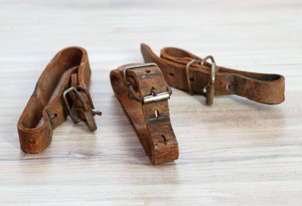 istock Old leather straps used to tie up skis together. 2199385873