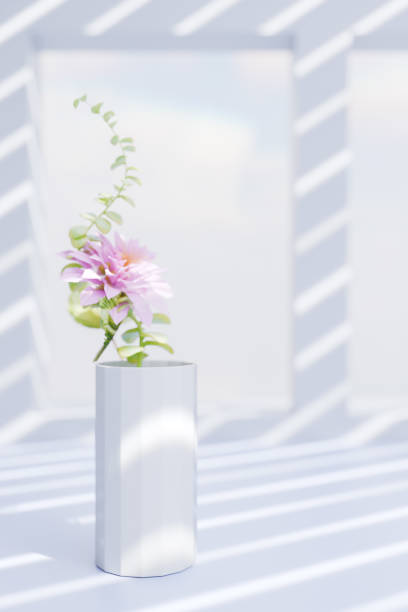 istock A beautiful flower arrangement in a white vase, illuminated by soft sunlight through window shadows. 3d rendering 2199386562