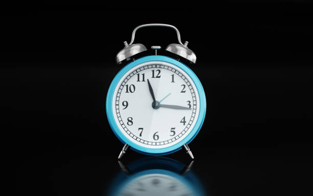 3d render Blue Alarm Clock with 11:15 on Black Glowing Background, Concept of Time